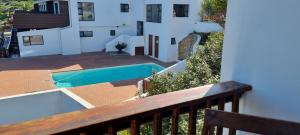 a balcony with a swimming pool on a building at 109 at Breede in Witsand