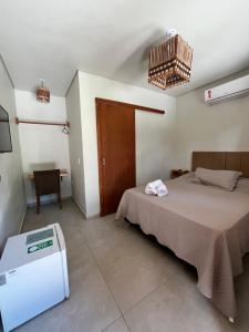 Postel nebo postele na pokoji v ubytování Pousada Vilarejo