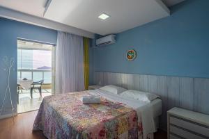 a bedroom with a bed and a view of the ocean at ITNC191 - Vista mar incrível do alto do 19º andar in Balneário Camboriú +61 photos