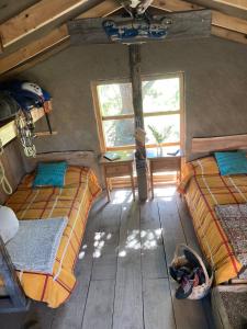 an overhead view of a bedroom with two beds and a desk at Refugio Casa Piedra in Puerto Ingeniero Ibáñez +12 photos