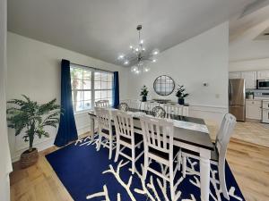 a dining room with a table and chairs at Shore Thing in Palm Coast +28 photos