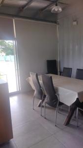 a meeting room with a large table and chairs at monoambiente grande, pileta arroyo seco in Arroyo Seco