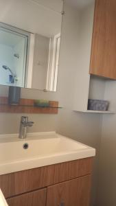 a bathroom with a sink and a mirror at Azur072 in Fréjus +27 photos