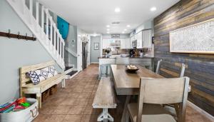 a kitchen and dining room with a wooden table and chairs at Silver Sands Townhomes Unit 4 in Inlet Beach