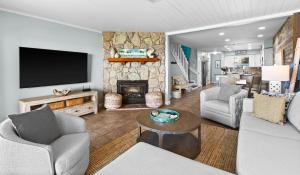 a living room with a tv and a fireplace at Silver Sands Townhomes Unit 4 in Inlet Beach