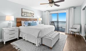 a bedroom with a bed and a window with a view at Silver Sands Townhomes Unit 4 in Inlet Beach +26 photos