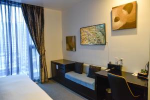 Postel nebo postele na pokoji v ubytování The One Boutique Hotel