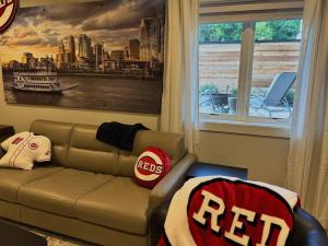 a living room with a couch and a window at Mt Adams Adventure in Cincinnati