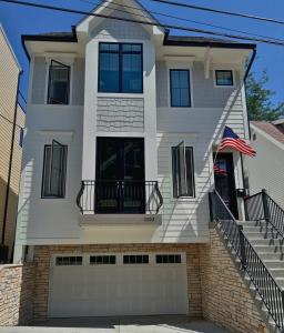 a white house with an american flag at Mt Adams Adventure in Cincinnati