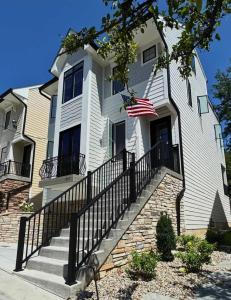 a white house with an american flag on it at Mt Adams Adventure in Cincinnati +41 photos