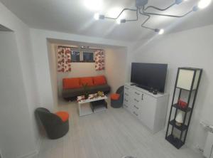 TV a/nebo společenská místnost v ubytování Apartament u Majki