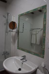 a bathroom with a sink and a mirror at HOTEL FONDA de La TEA in Tejeda