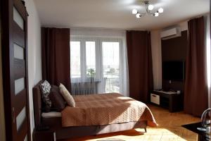 Postel nebo postele na pokoji v ubytování Travel Apartament Cracow