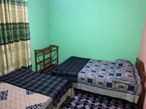 Postel nebo postele na pokoji v ubytování Holiday Guest in Nuwara Eliya