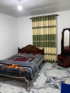 Postel nebo postele na pokoji v ubytování Holiday Guest in Nuwara Eliya