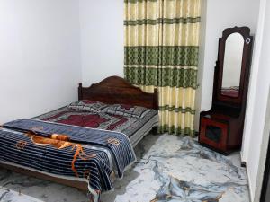 Postel nebo postele na pokoji v ubytování Holiday Guest in Nuwara Eliya