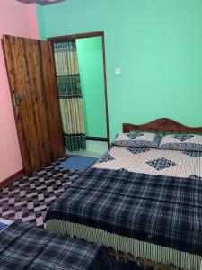 Postel nebo postele na pokoji v ubytování Holiday Guest in Nuwara Eliya