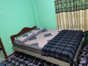 Postel nebo postele na pokoji v ubytování Holiday Guest in Nuwara Eliya