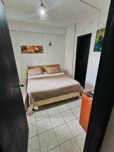 Postel nebo postele na pokoji v ubytování CENTRAL RIVIERA HOTEL Asunción