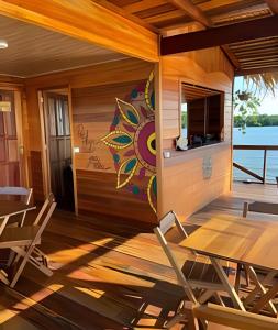 a dining room with a mural on the wall at Casa Flutuante - Experiência única in Manaus +70 photos