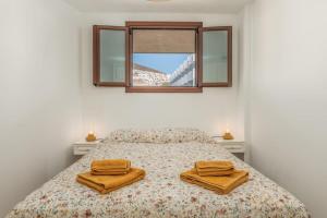 En eller flere senge i et værelse på Santa Amalia Beach