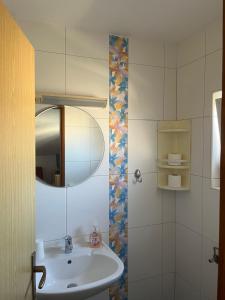 a bathroom with a sink and a mirror at Lavanda Apartments in Pakoštane +109 photos