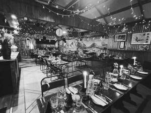 a black and white photo of a restaurant with tables and chairs at Town House Creeslough in Creeslough