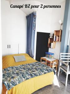 เตียงในห้องที่ L'appartement de l'Arche