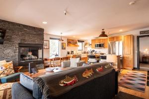 a living room with a couch and a fireplace at Christophe Condo 712 in Ketchum