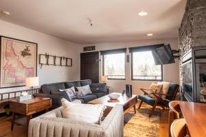 a living room with a couch and a table at Christophe Condo 712 in Ketchum