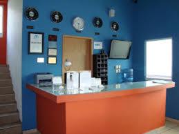 a blue wall with an orange counter in a room at Hotel CEO in Morelia