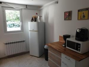 Kuchyň nebo kuchyňský kout v ubytování Maison de campagne + 1 fotografie