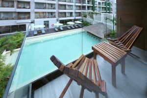 Bazén v ubytování Holiday Inn Tulum by IHG nebo v jeho okolí