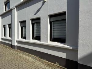 a row of windows on the side of a building at Beethoven Apartments in Solingen