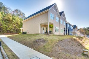a house with a large yard in front of it at Atlanta Home with Patio, 8 Mi to Downtown and Aquarium in Atlanta