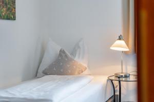 Łóżko lub łóżka w pokoju w obiekcie Hotel Gasthof Post