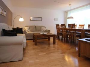 a living room with a couch and a table at Ferienwohnung Zauberhexe in Braunlage in Braunlage +5 photos