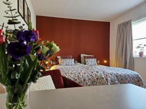 Postel nebo postele na pokoji v ubytování B&B it Arbeidershûske