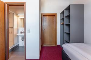 Łóżko lub łóżka w pokoju w obiekcie Hotel Gasthof Post