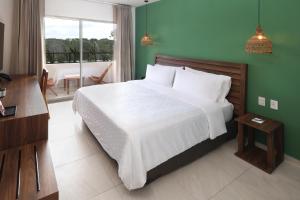 Postel nebo postele na pokoji v ubytování Holiday Inn Tulum by IHG