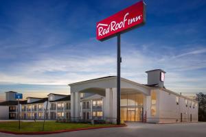 a building with a sign for a red rock motel at Red Roof Inn Stafford, TX in Stafford