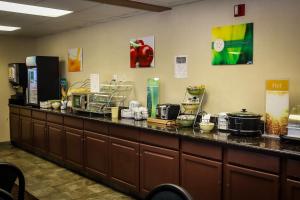 a long counter with pots and pans on it at Quality Inn Airport in Colorado Springs
