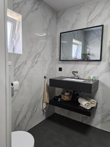 Koupelna v ubytování B&B it Arbeidershûske