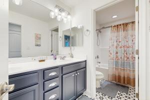 a bathroom with a sink and a toilet at Arbor-Lyn --- 19319 Loblolly Cir. in The Plantations +24 photos