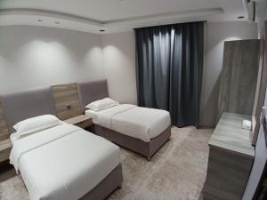 Postel nebo postele na pokoji v ubytování قمم النماص 2 Qimam alnamas