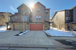 a house with a red garage in the driveway at Park City Retreat in Kamas
