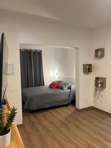 a bedroom with a bed and a large window at Casa Picacho in Tinajo +4 photos