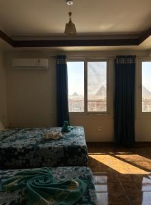 Vuode tai vuoteita majoituspaikassa Giza Pyramids View Guest house