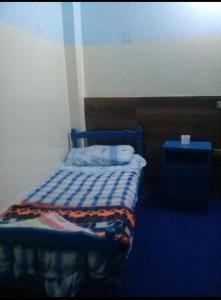 Postel nebo postele na pokoji v ubytování Oasis hotel