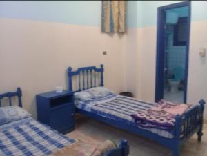 Postel nebo postele na pokoji v ubytování Oasis hotel